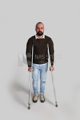 young man using crutches