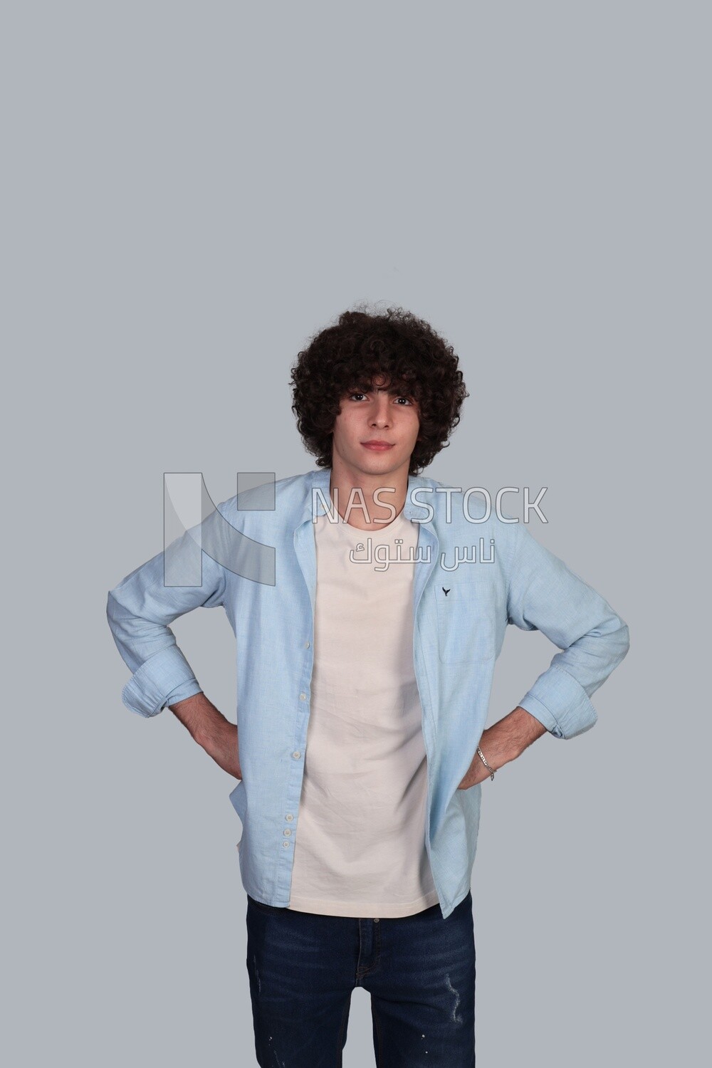 young man with thick curly hair