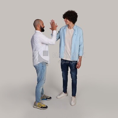 two friends shaking hands happily
