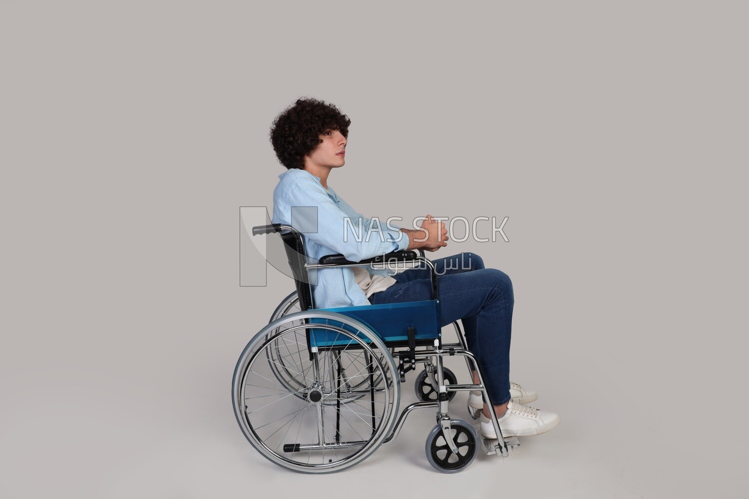 disabled young man sitting in a wheelchair