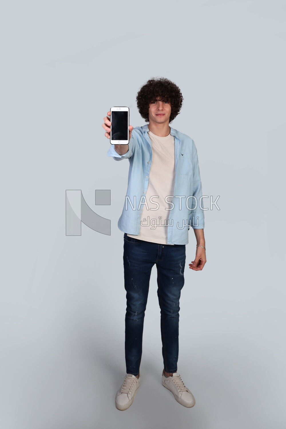 handsome young man pointing his phone at the camera