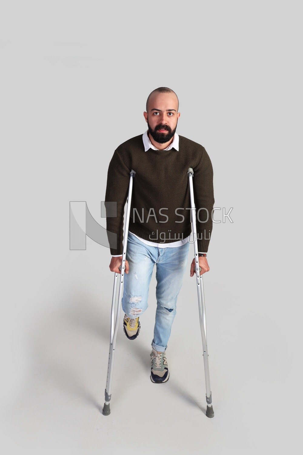 young man using crutches