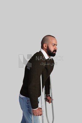 Injured young man on crutches