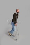 Man leaning on a crutch