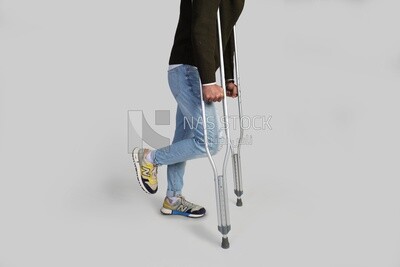 Man walks with crutches
