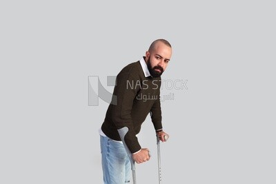 Man leaning on a crutch