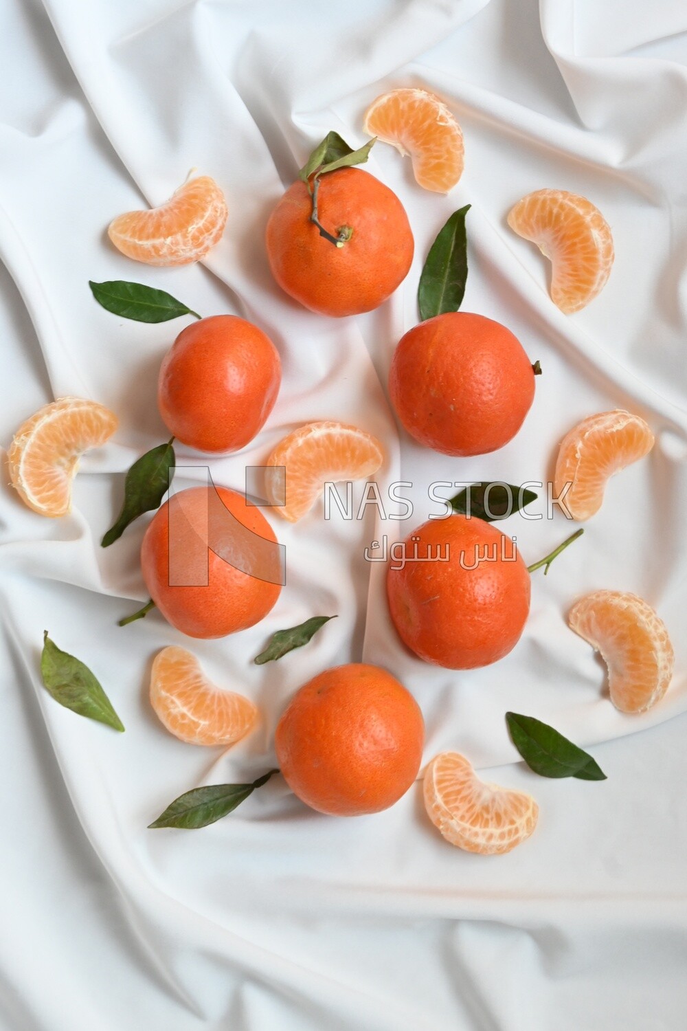 Tangerine with tangerine slices on a white background
