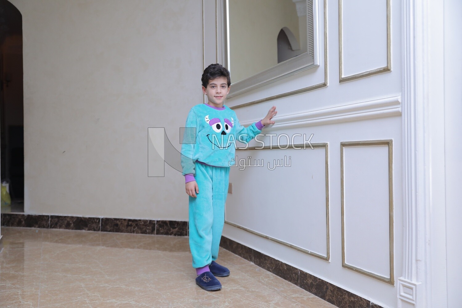 a boy standing in the living room