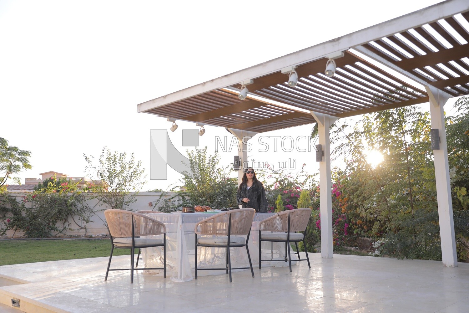 a mother preparing the dining table in the garden