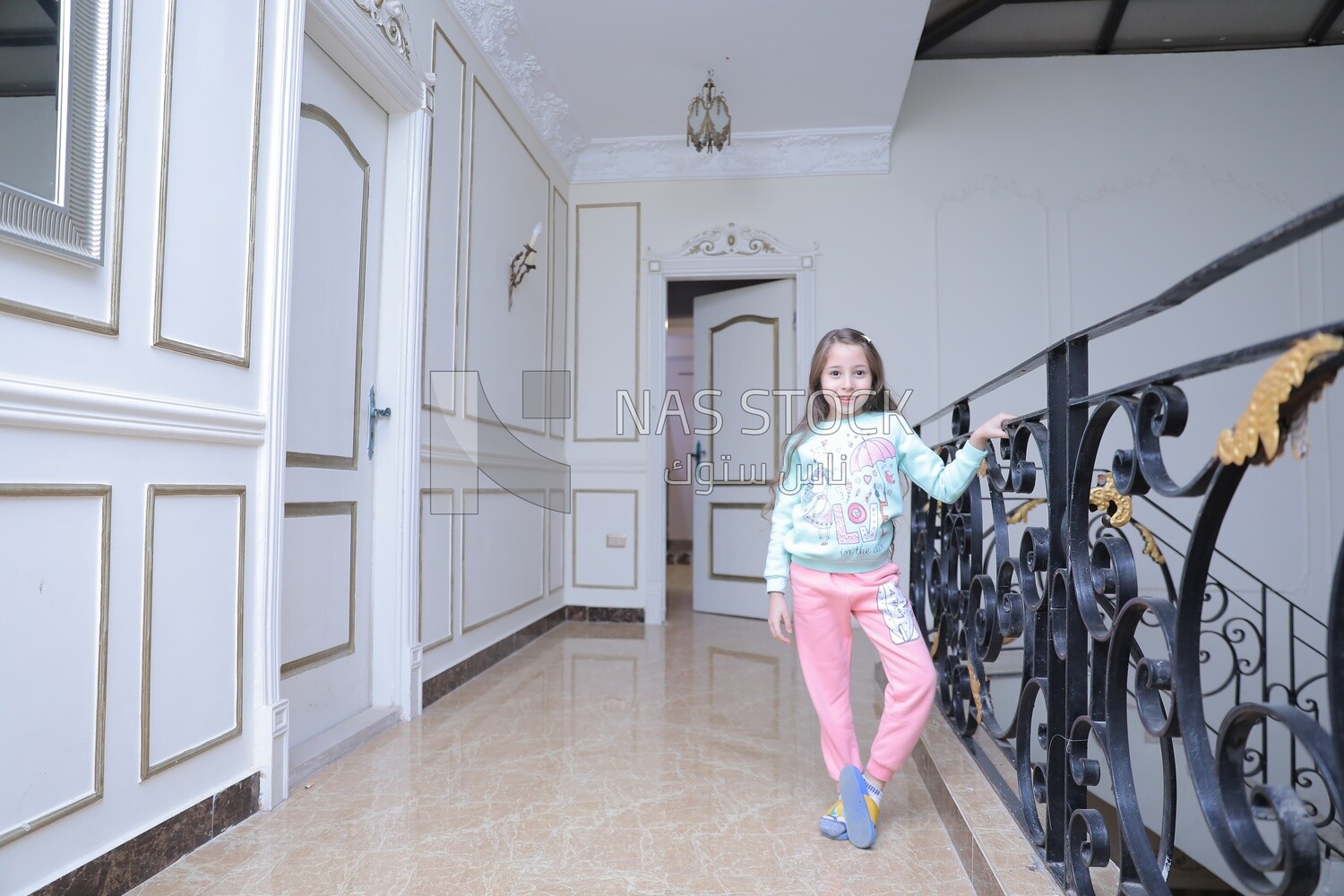 a girl standing in the living room