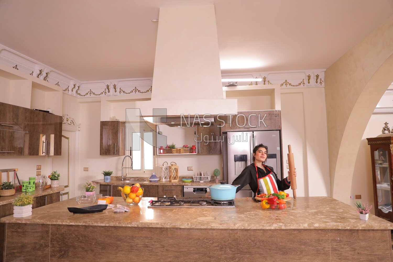 a woman cooking in the kitchen