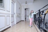 a girl standing in the living room