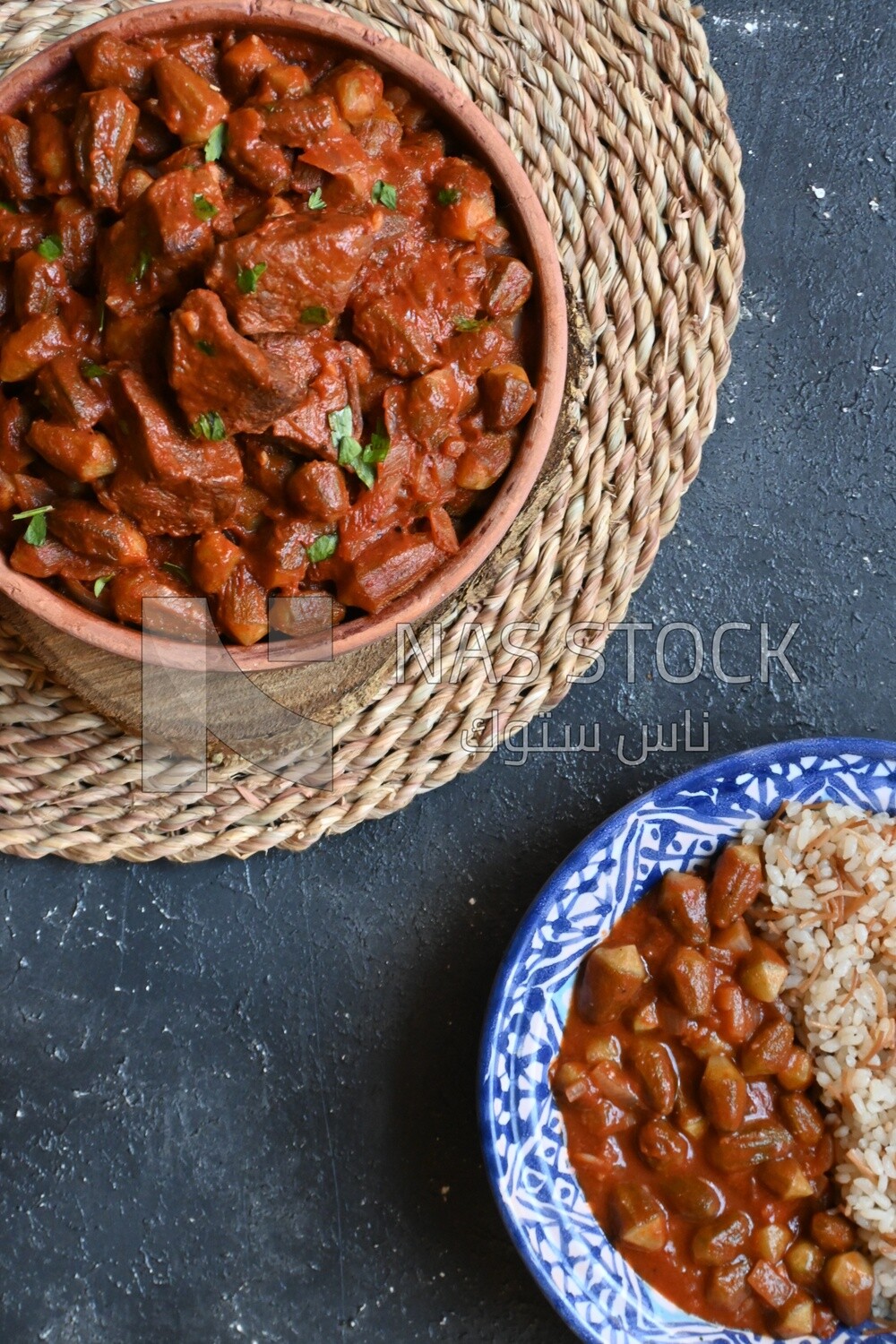 Top view of a delicious okra dish with sauce and meat, Plate rice, Arabic meals, recipes and delicious food dishes, delicious meals, delicious food, okra dish