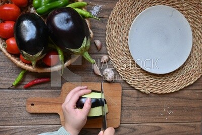 Hand cutting the eggplant