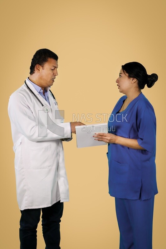 Doctor standing with a nurse