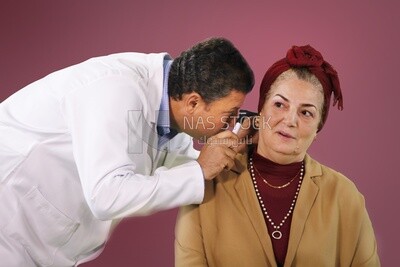 Doctor tries to help an old patient woman