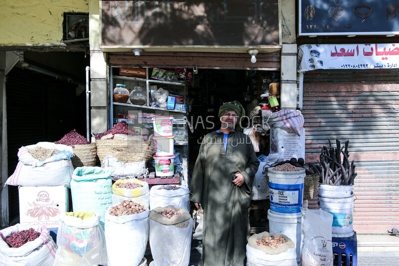 Man selling fragrant and legumes