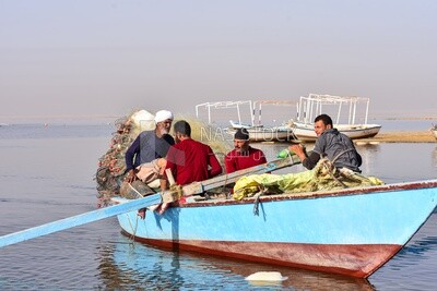 Group of fishermen sailing to fish