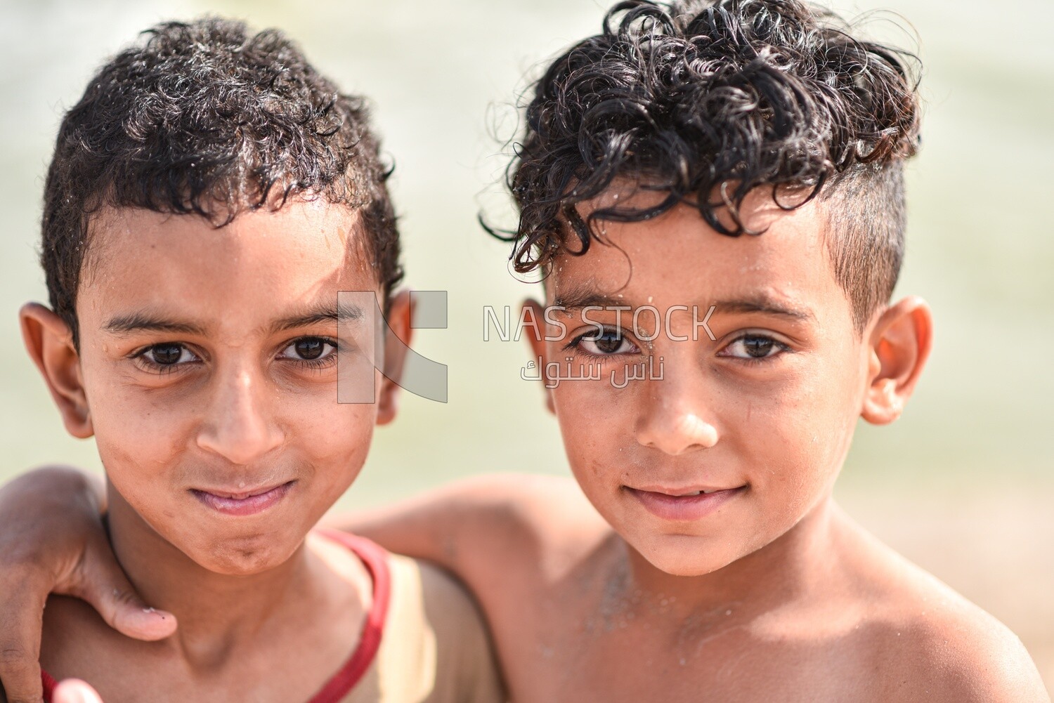 Two kids smile