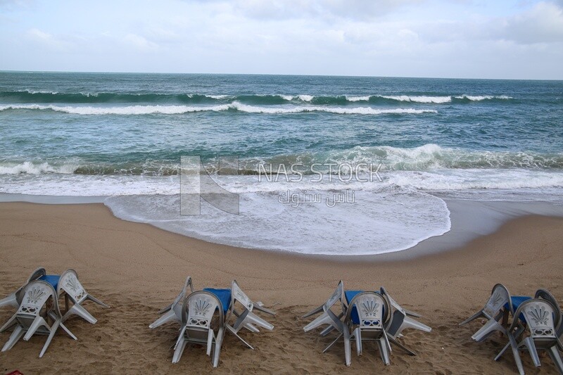 Tables and chairs on the beach