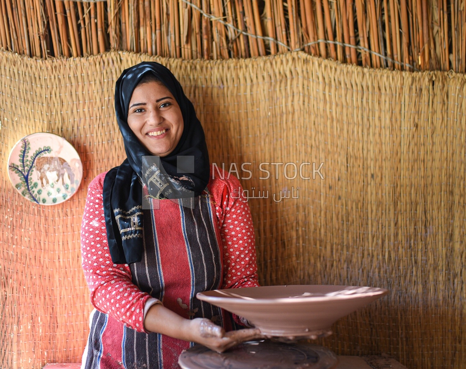 Lady makes pottery