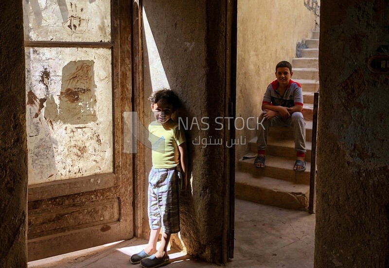 Boy and girl in old house