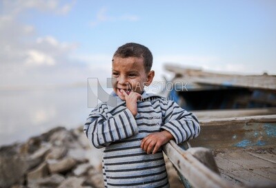 Kid hold fish boat