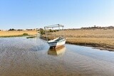 Two fresh  wooden boat moored on the bank of a lake