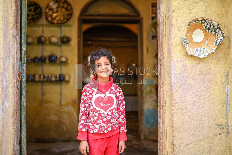 Girl at a pottery shop