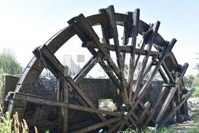 Wooden wheel on a water mill