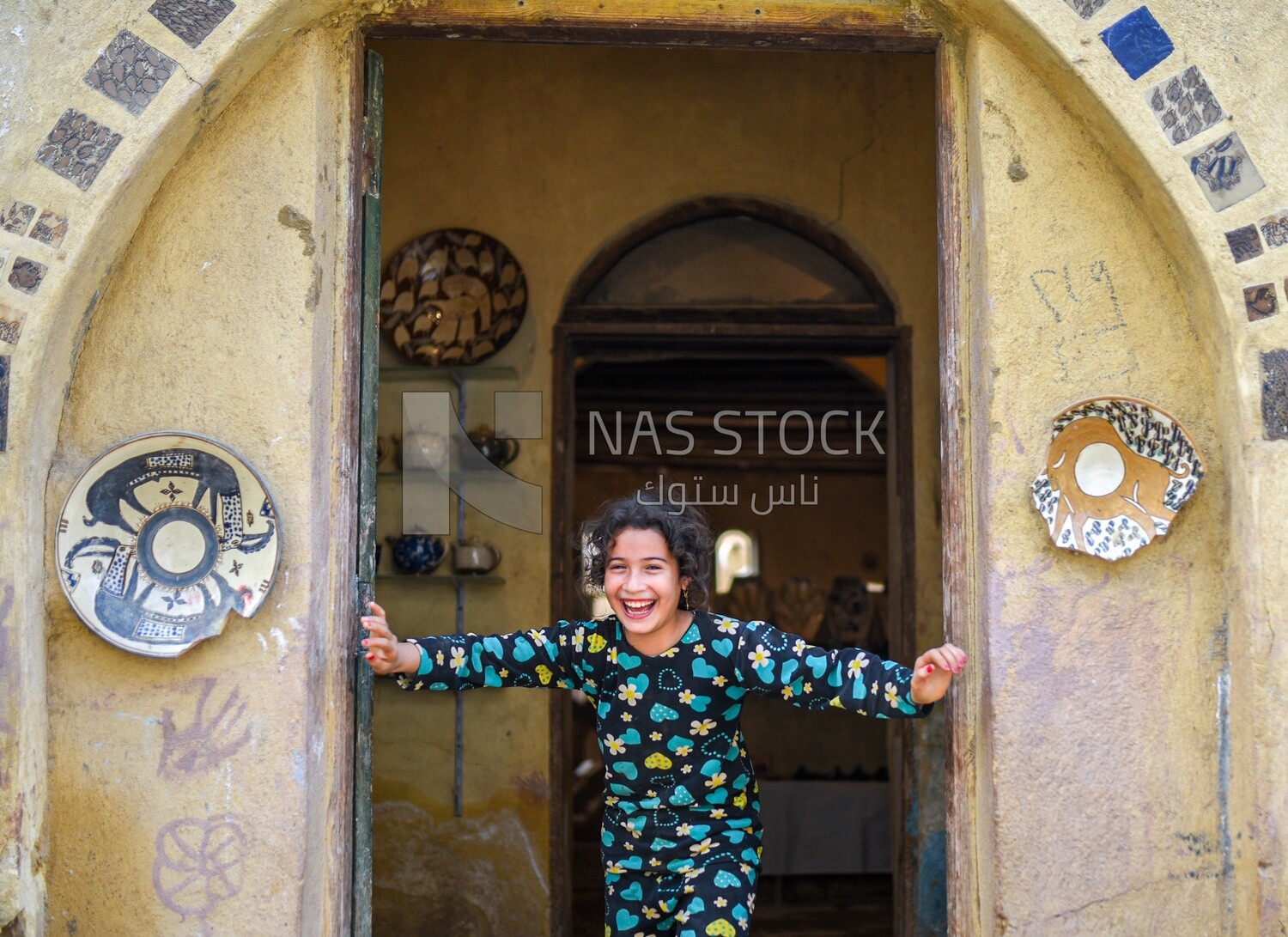 Girl at a pottery shop