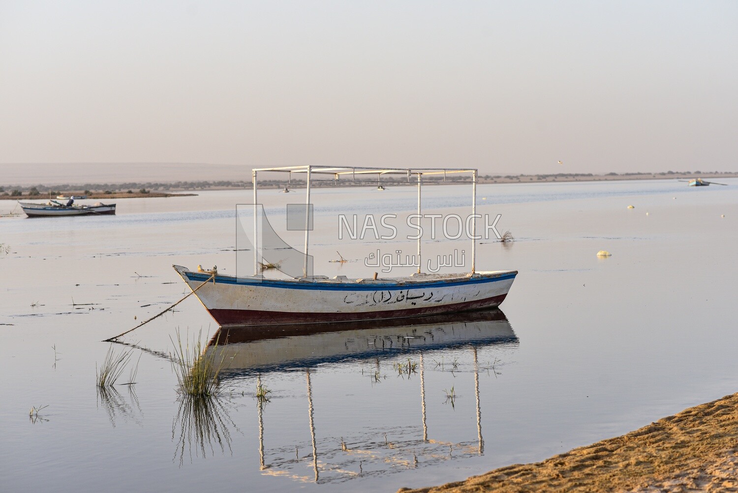 Wooden boat moored in one of the lakes of Egypt