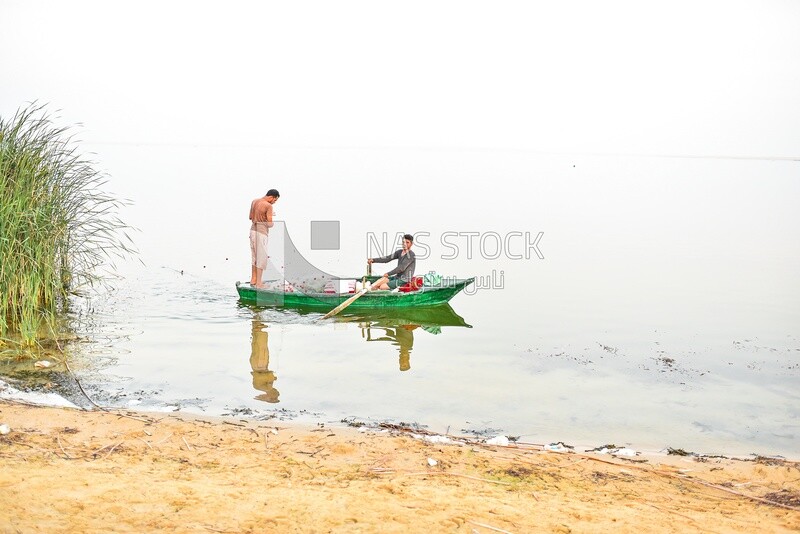 Egyptian fishermen with wooden boats