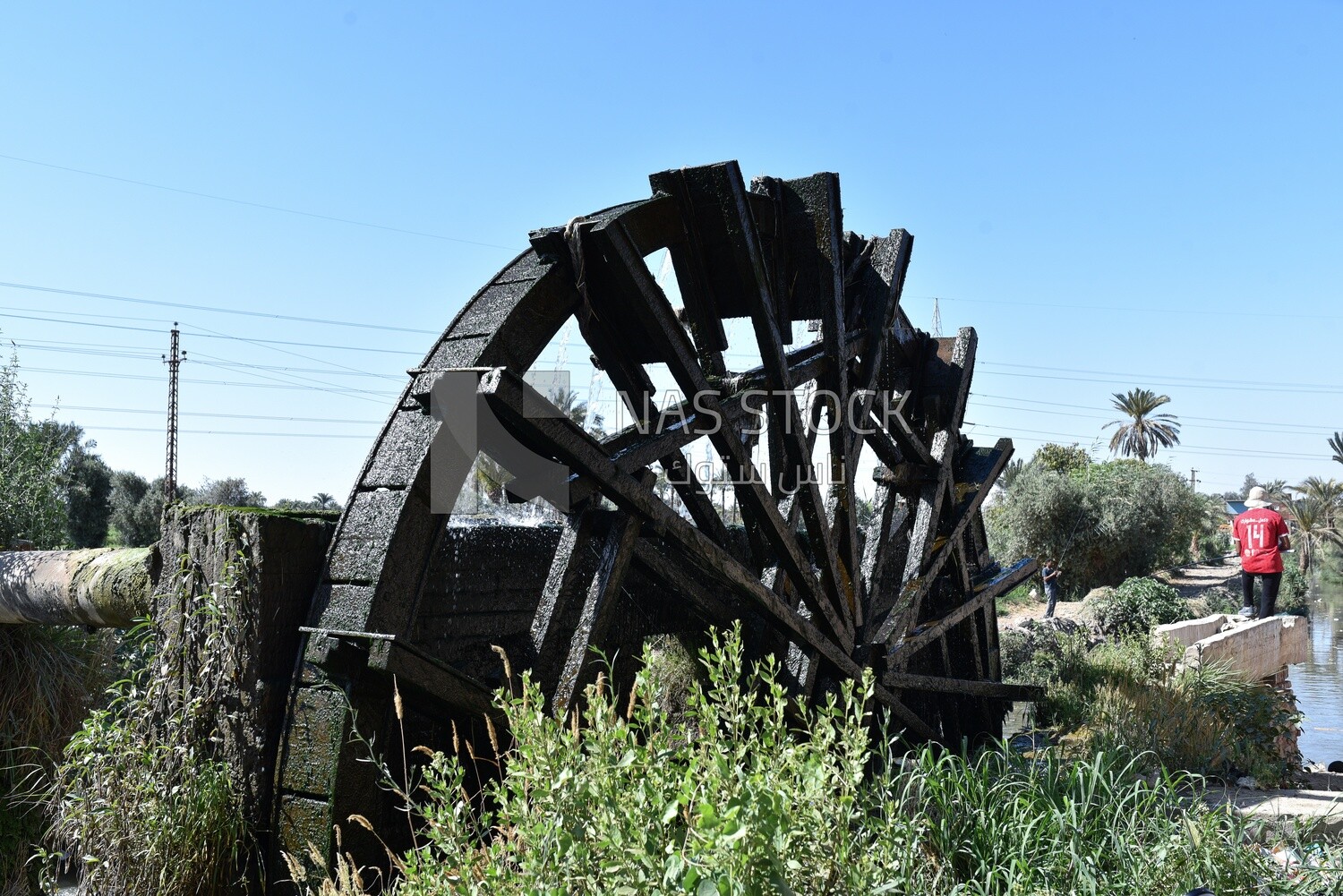 Wooden wheel on a water mill