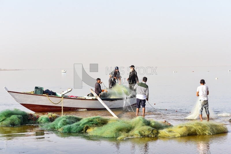 Group of Egyptian fishermen with many fishing nets