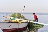 Young man working in fishing