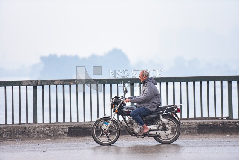 Adult man riding a motorcycle