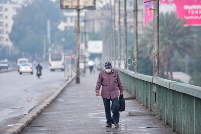 Elderly man carrying a bag , Egypt