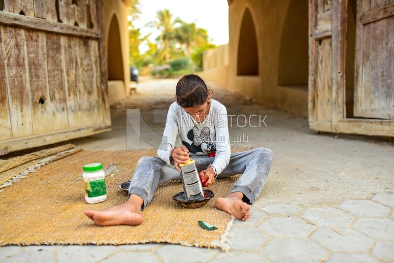 Egyptian rural girl preparing food