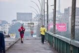 Two men jogging on Corniche in Egypt