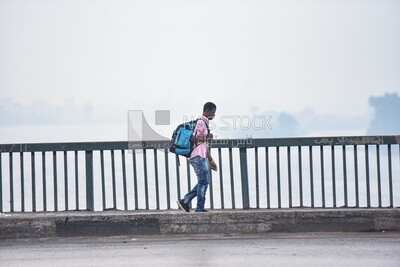 African man walking on Abbas Bridge Corniche, Egypt