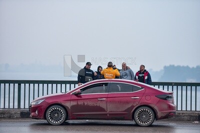 Group of men taking photos