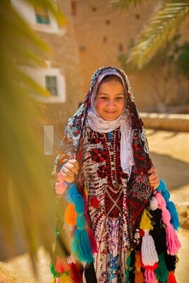 Girl with traditional clothes, landmarks, desert