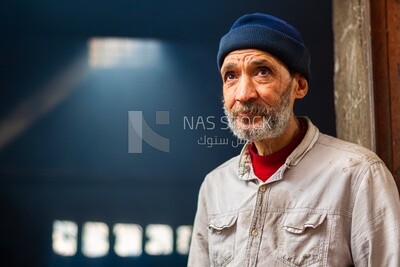 Close up photo of an old man, work, summer