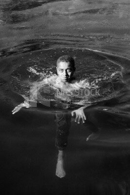 Boy swimming in the sea, sports, boats