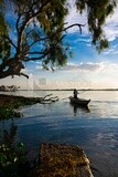 Man sitting on a boat, fishing, work, summer