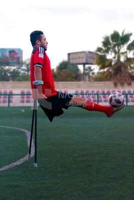 Disabled young man playing football, patient, sports