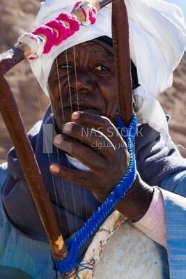 Close up photo of an old man, work, summer