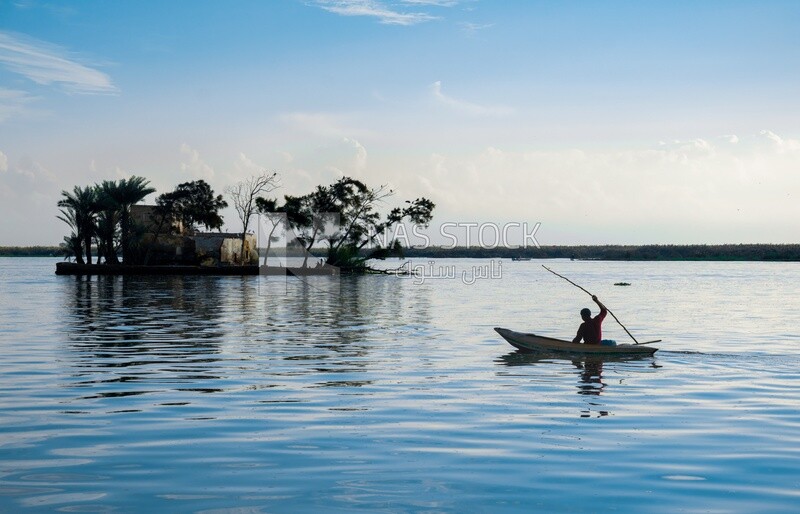 Man sitting on a boat, fishing, work, summer