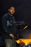 Man working in a workshop to melts metal, workshop, activities